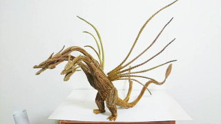 Illustration for article titled Godzilla Made from Pine Tree Branches Is a Lovely Fire Hazard